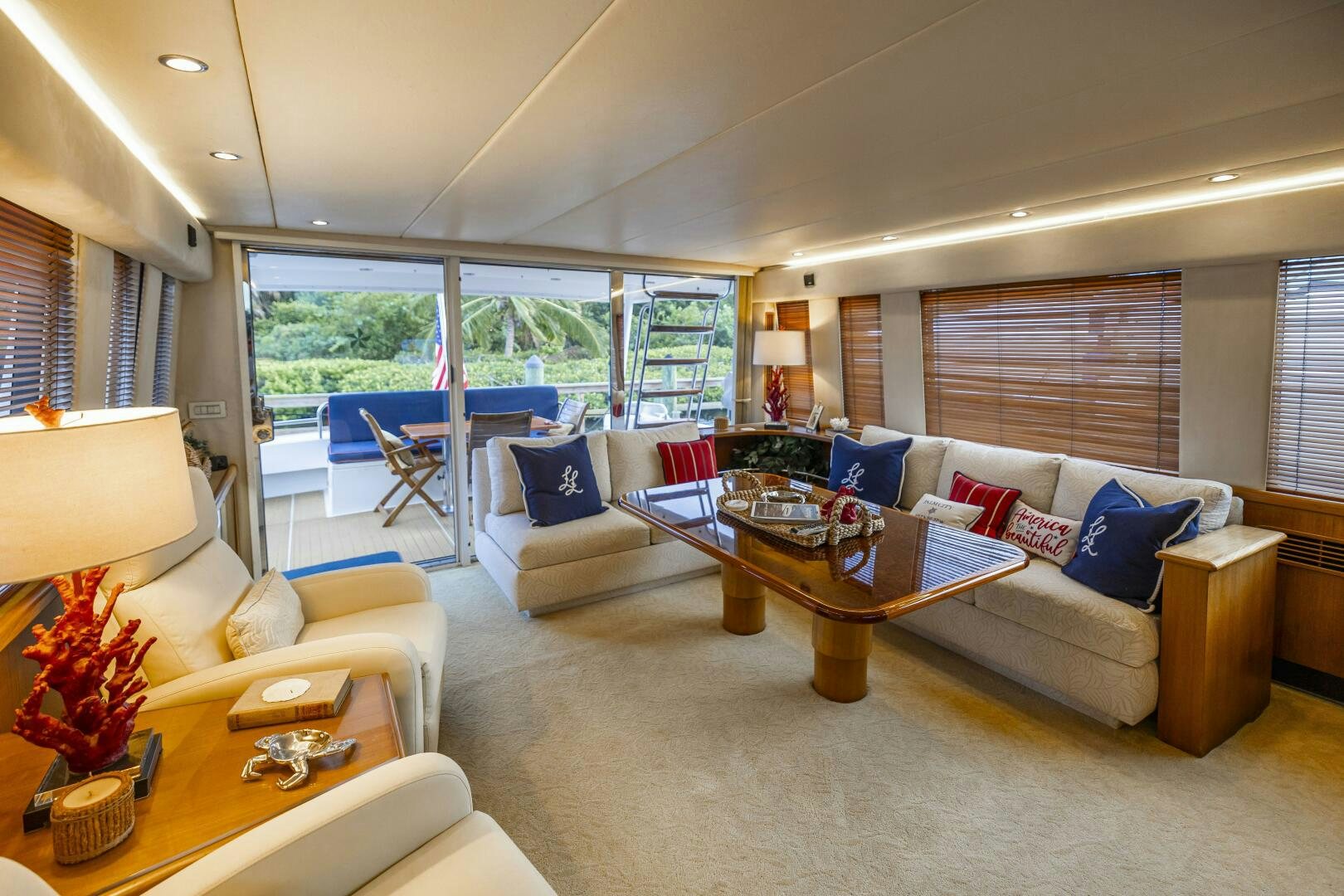 a living room with a couch and a table aboard LADY LETICIA V Yacht for Sale