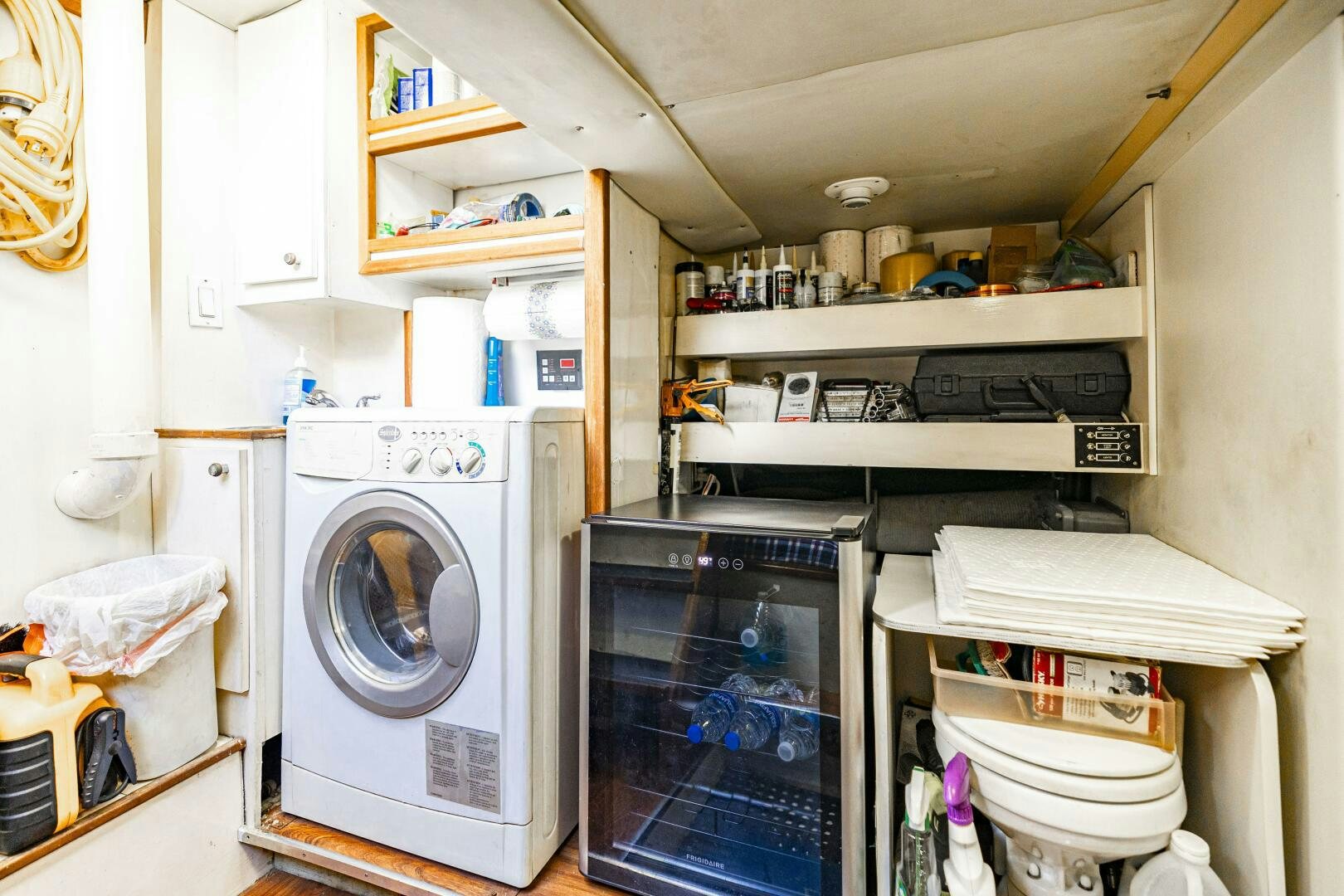a white laundry room aboard LADY LETICIA V Yacht for Sale