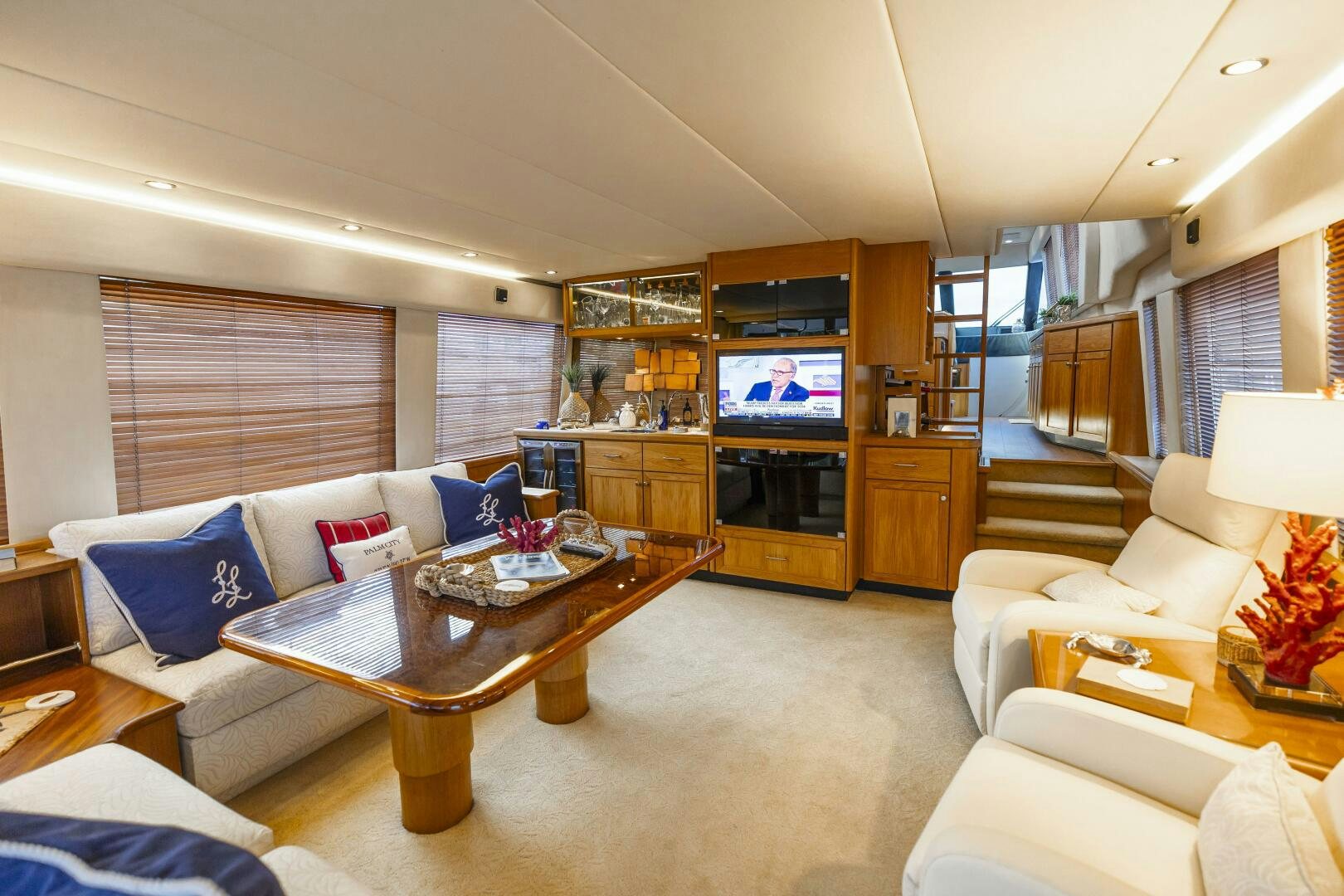 a living room with a large television aboard LADY LETICIA V Yacht for Sale