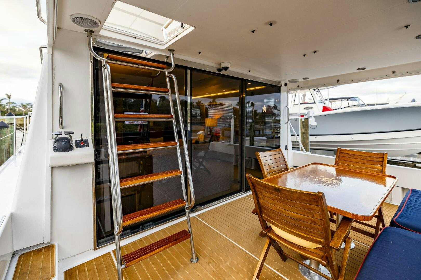 a room with a table and chairs aboard LADY LETICIA V Yacht for Sale