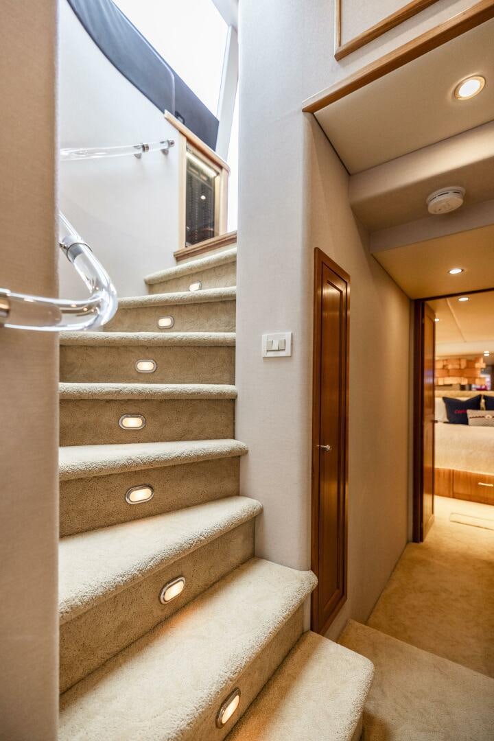 a staircase with a glass door aboard LADY LETICIA V Yacht for Sale