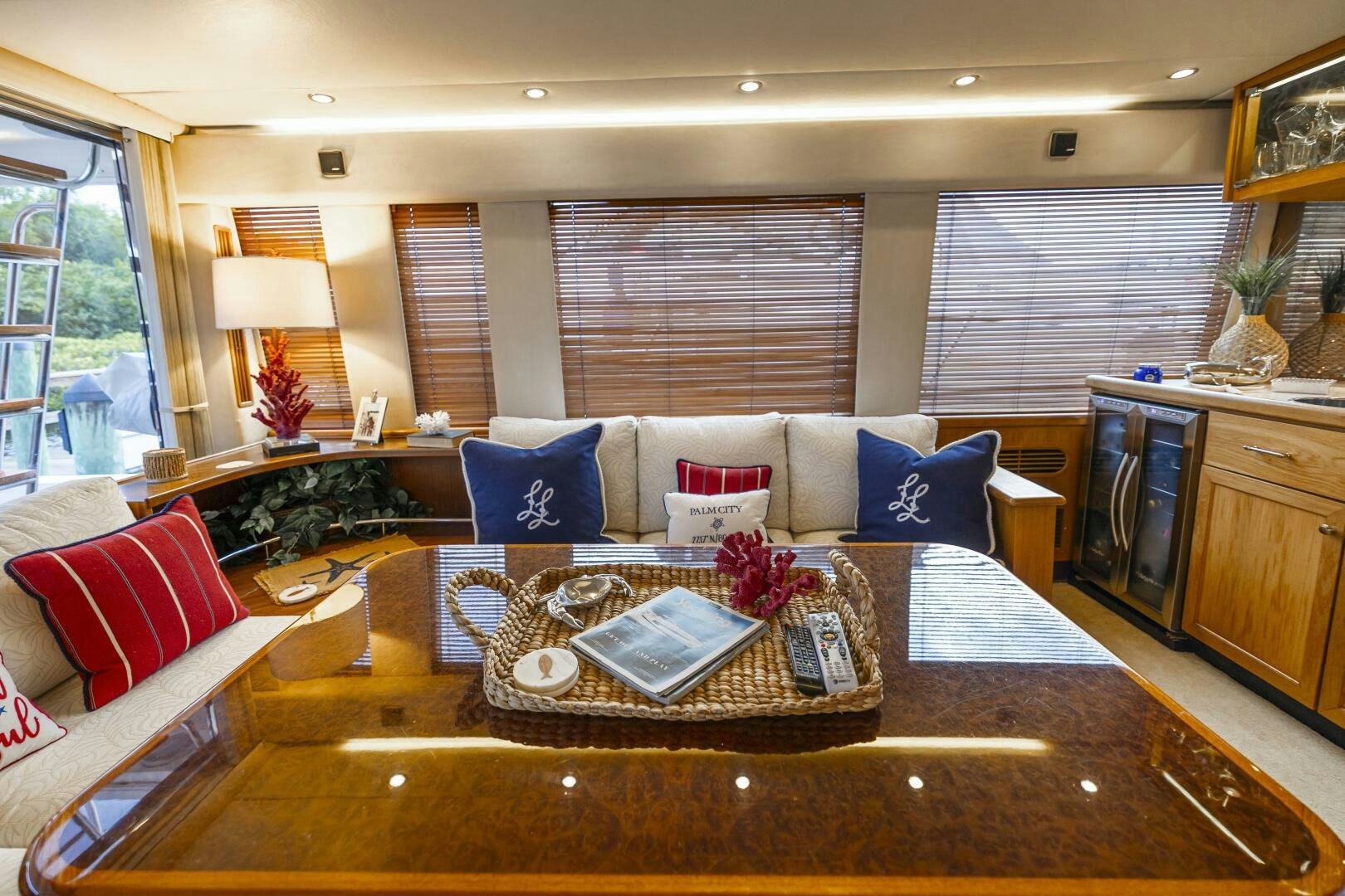 a large living room with a large table and couches aboard LADY LETICIA V Yacht for Sale