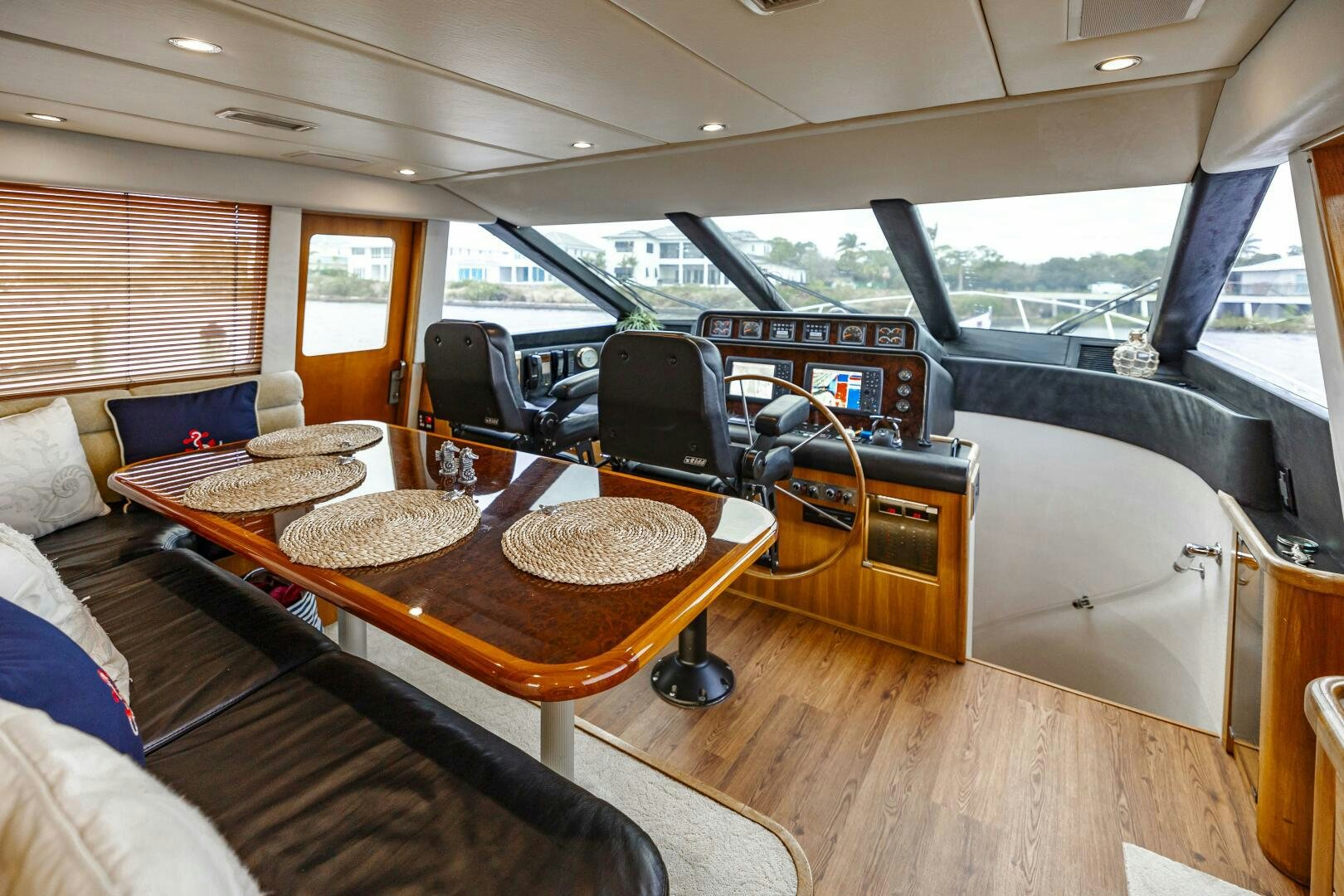 a room with a table and chairs aboard LADY LETICIA V Yacht for Sale