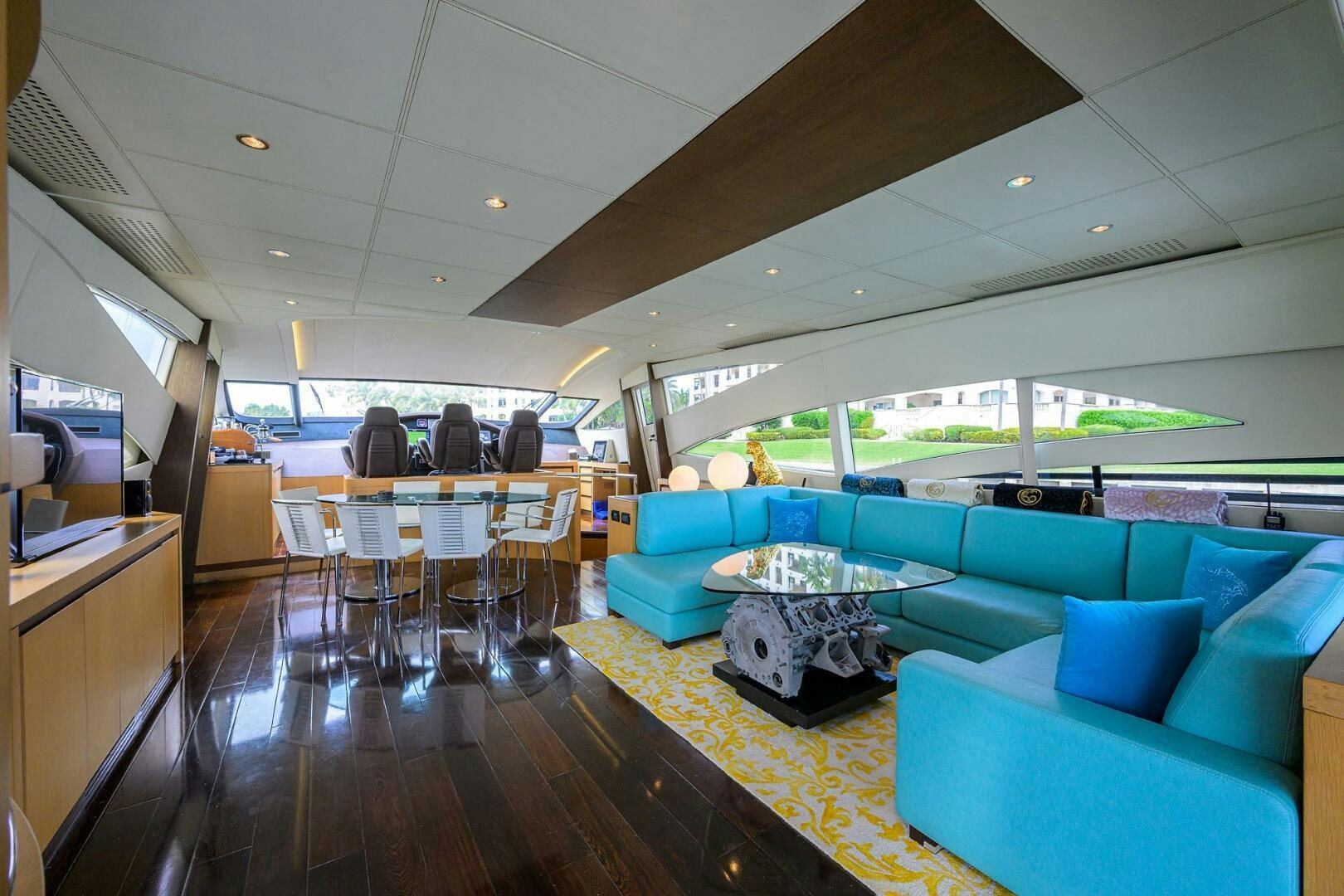a room with a table and chairs aboard MIURA Yacht for Sale