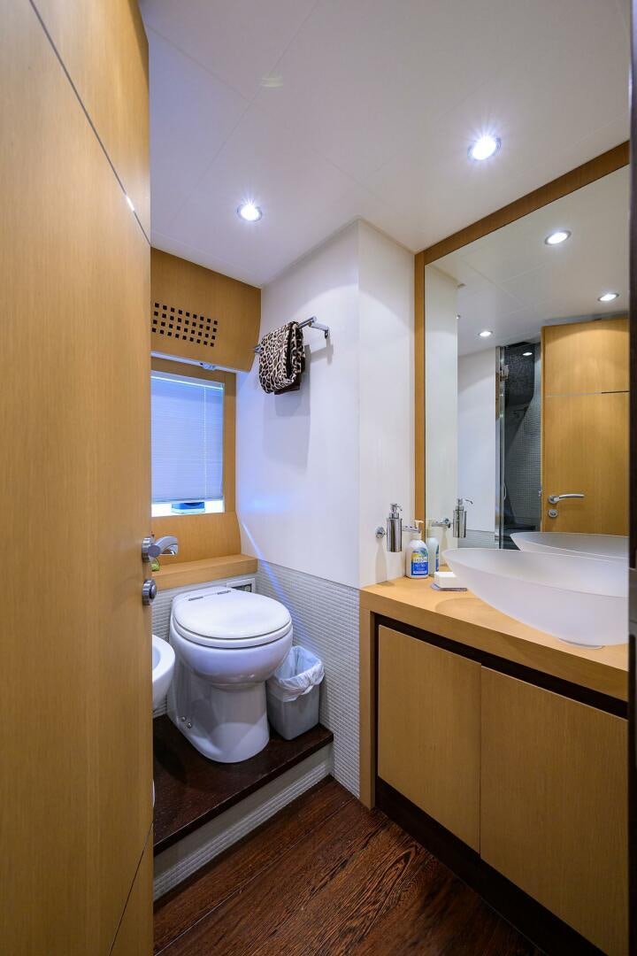a bathroom with a toilet and a sink aboard MIURA Yacht for Sale
