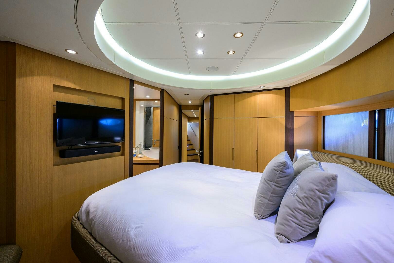 a bed with white sheets aboard MIURA Yacht for Sale