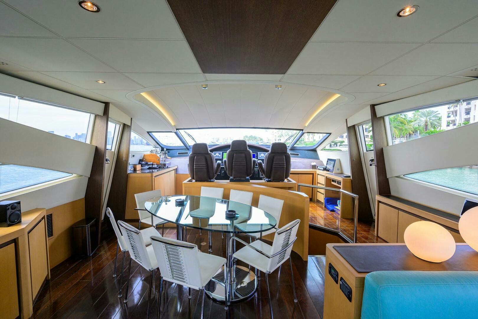 a room with tables and chairs aboard MIURA Yacht for Sale