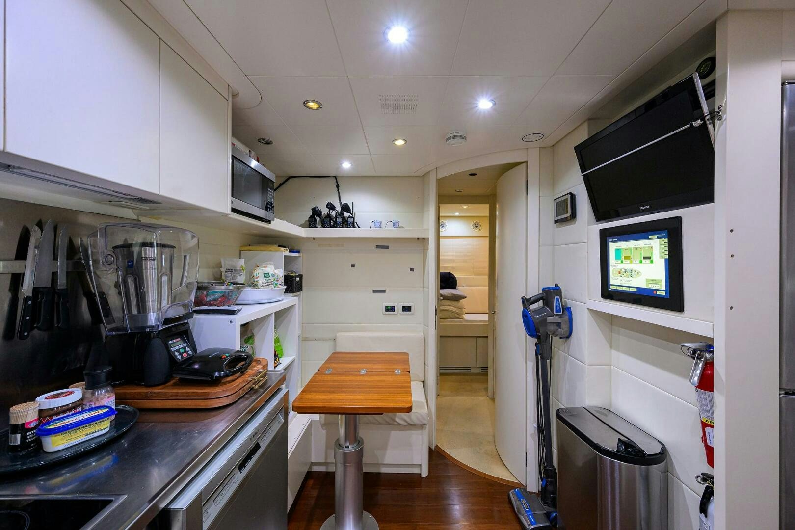 a kitchen with a small island aboard MIURA Yacht for Sale