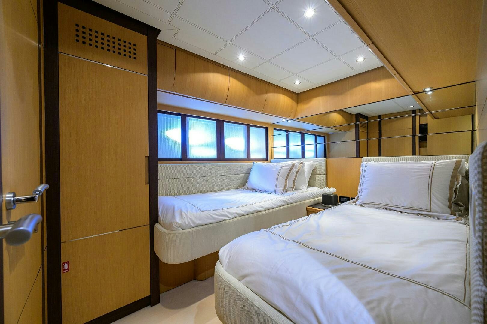 a room with two beds aboard MIURA Yacht for Sale