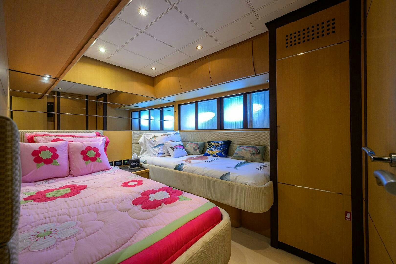 a couple of beds in a room aboard MIURA Yacht for Sale