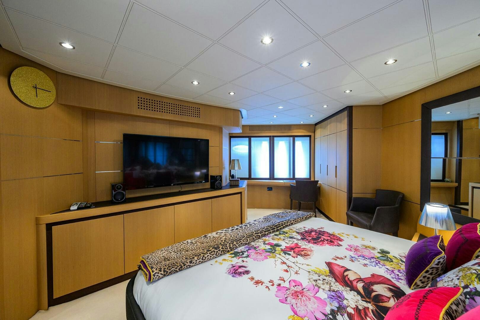 a bedroom with a tv and a bed aboard MIURA Yacht for Sale