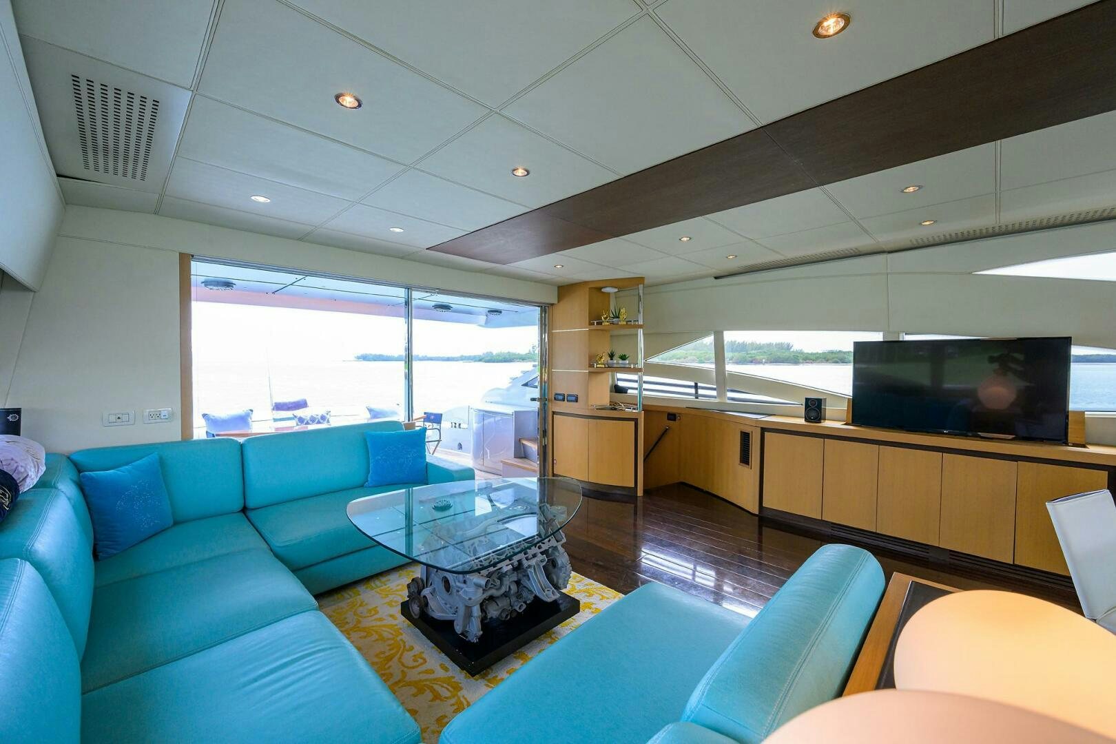 a room with a couch and a table aboard MIURA Yacht for Sale