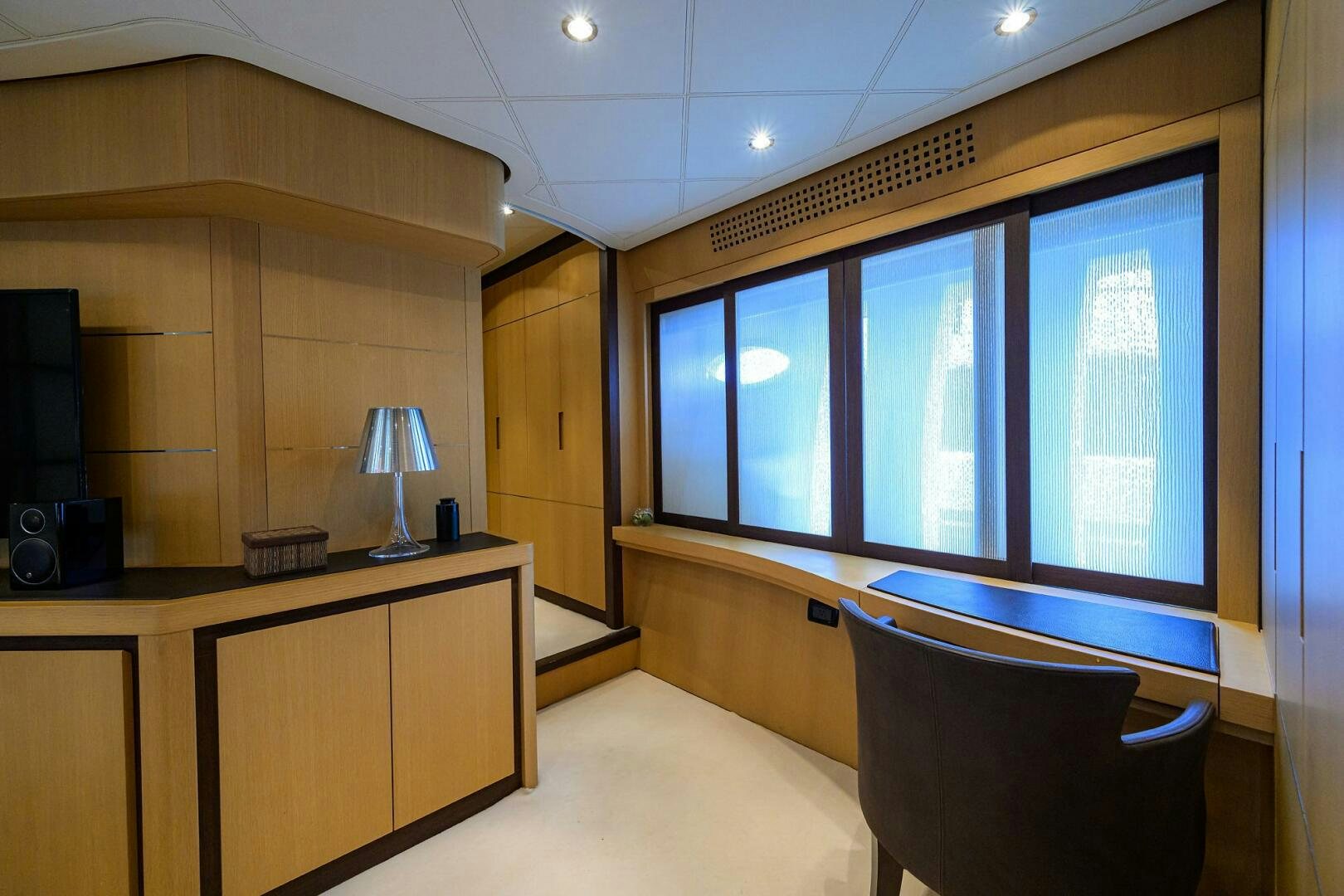 a room with a large window aboard MIURA Yacht for Sale