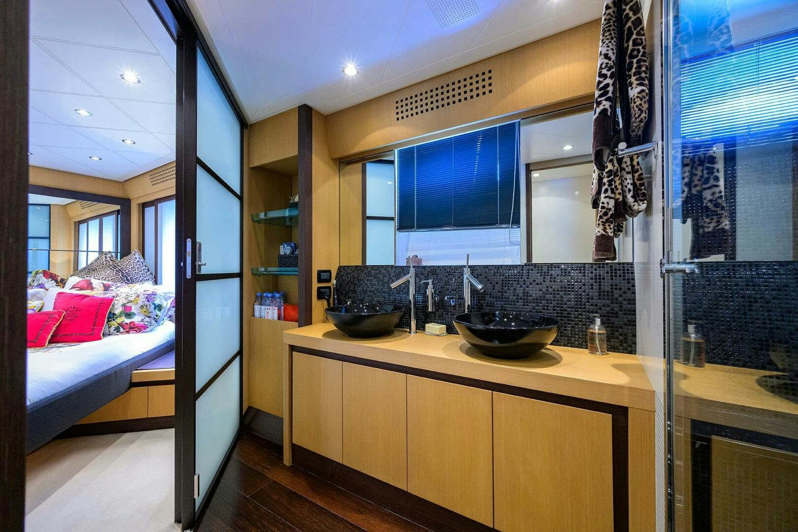 a bathroom with a sink and a bed aboard MIURA Yacht for Sale