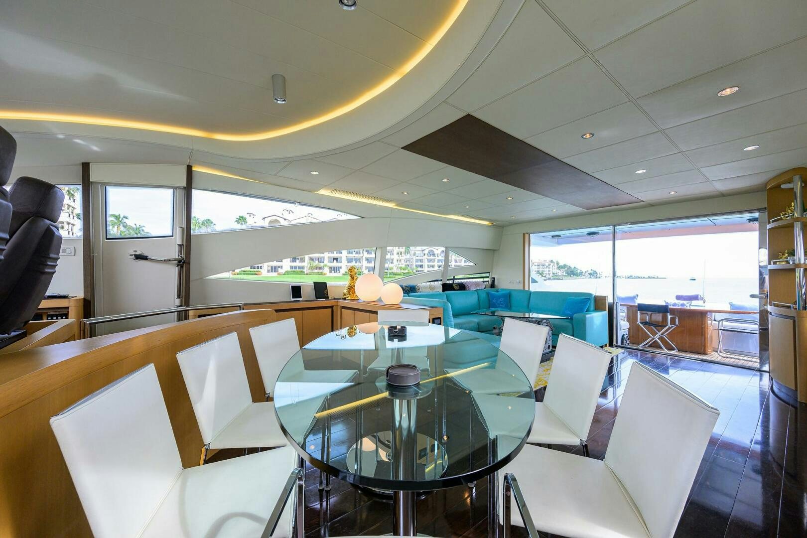 a room with tables and chairs aboard MIURA Yacht for Sale