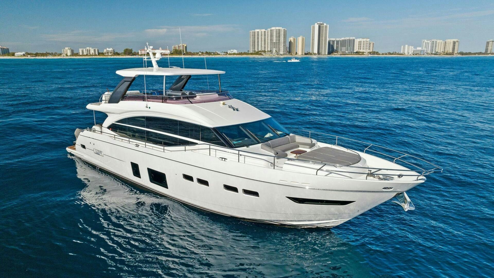 a white yacht on the water aboard AMICI Yacht for Sale
