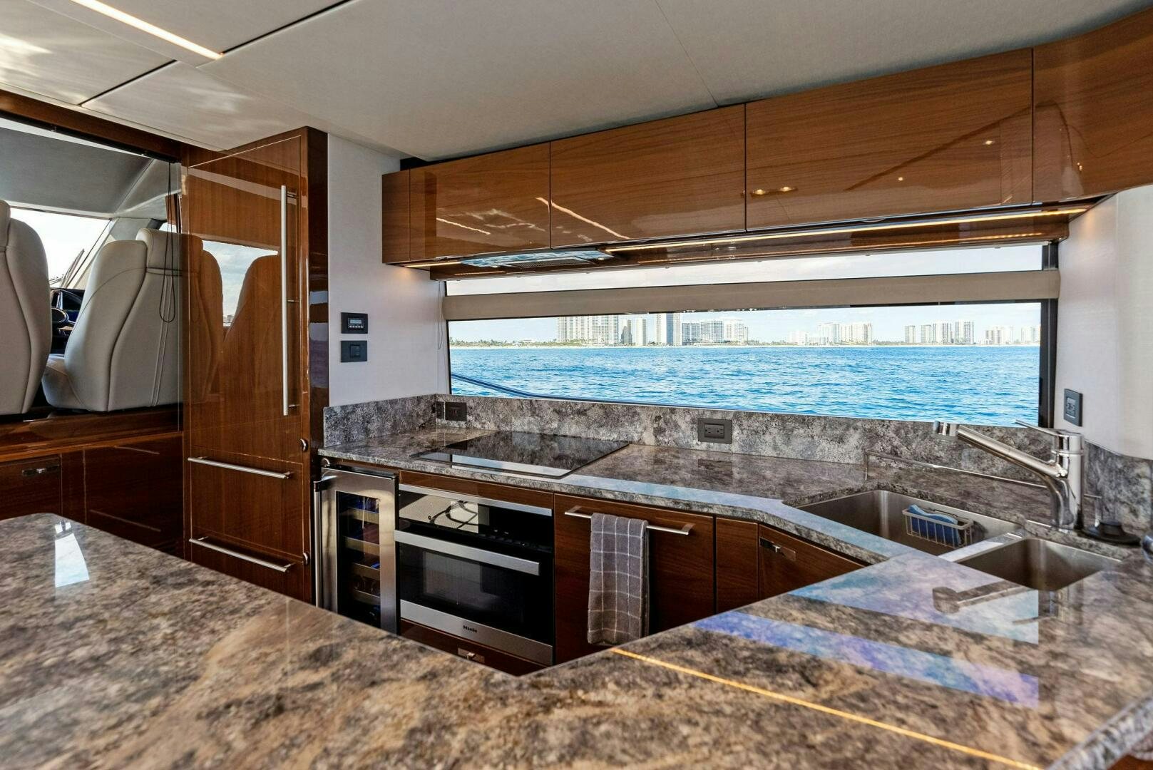 a kitchen with marble counters aboard AMICI Yacht for Sale