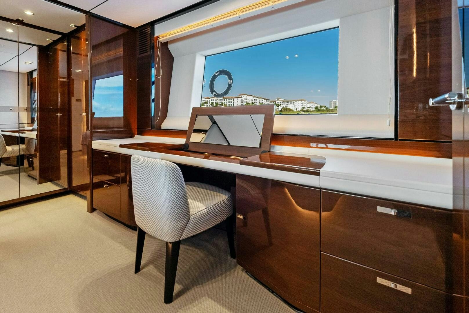 a room with a table and chairs aboard AMICI Yacht for Sale