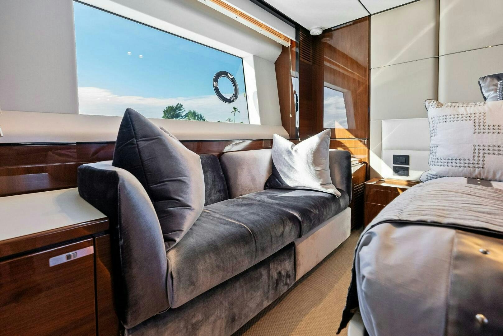 a leather couch in a room aboard AMICI Yacht for Sale