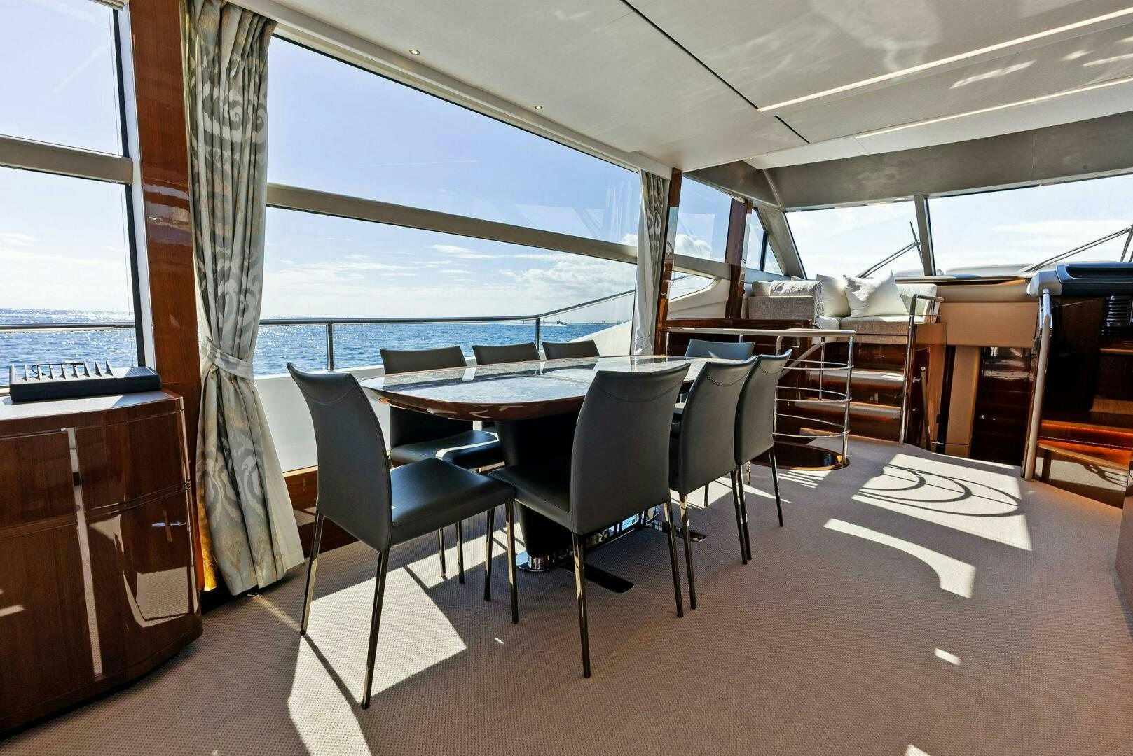 a room with a table and chairs aboard AMICI Yacht for Sale