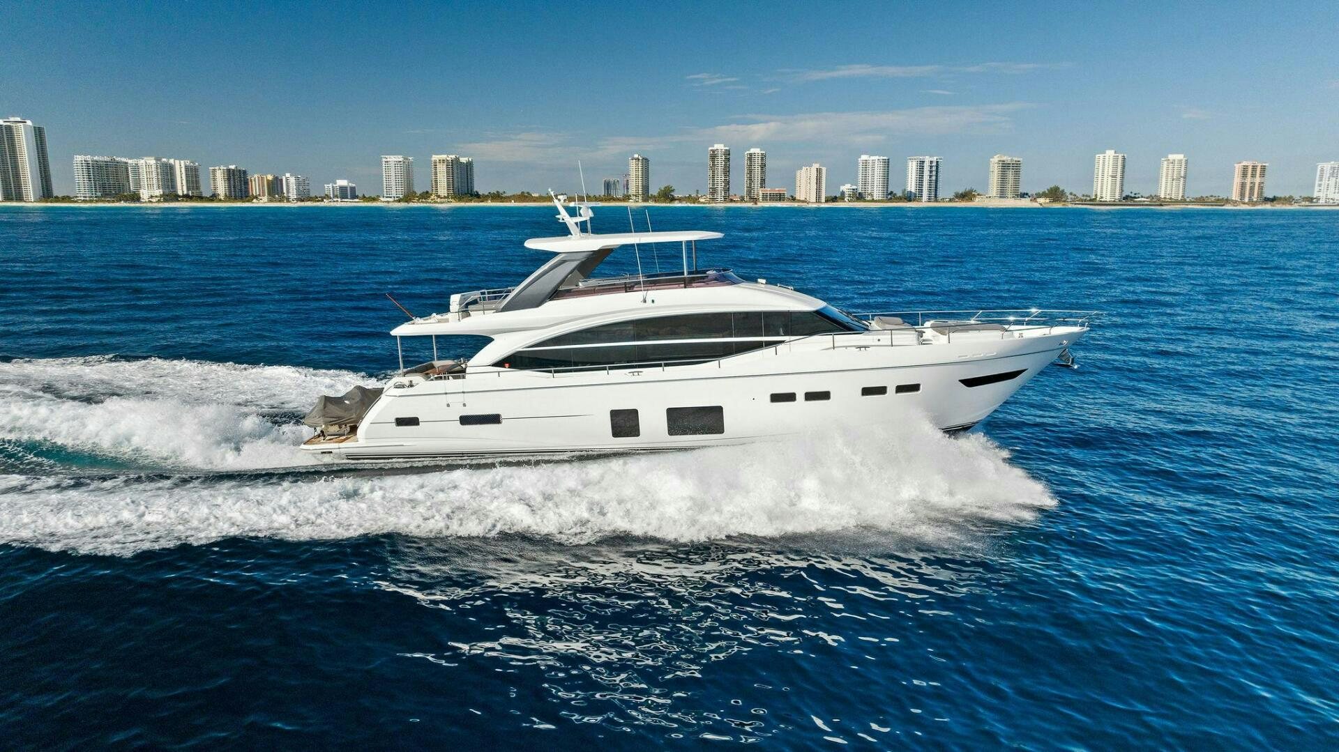 a white yacht on the water aboard AMICI Yacht for Sale