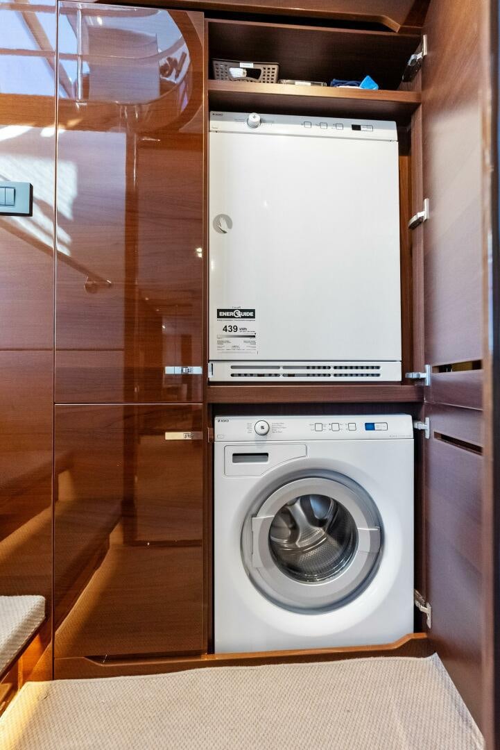 a white washing machine aboard AMICI Yacht for Sale