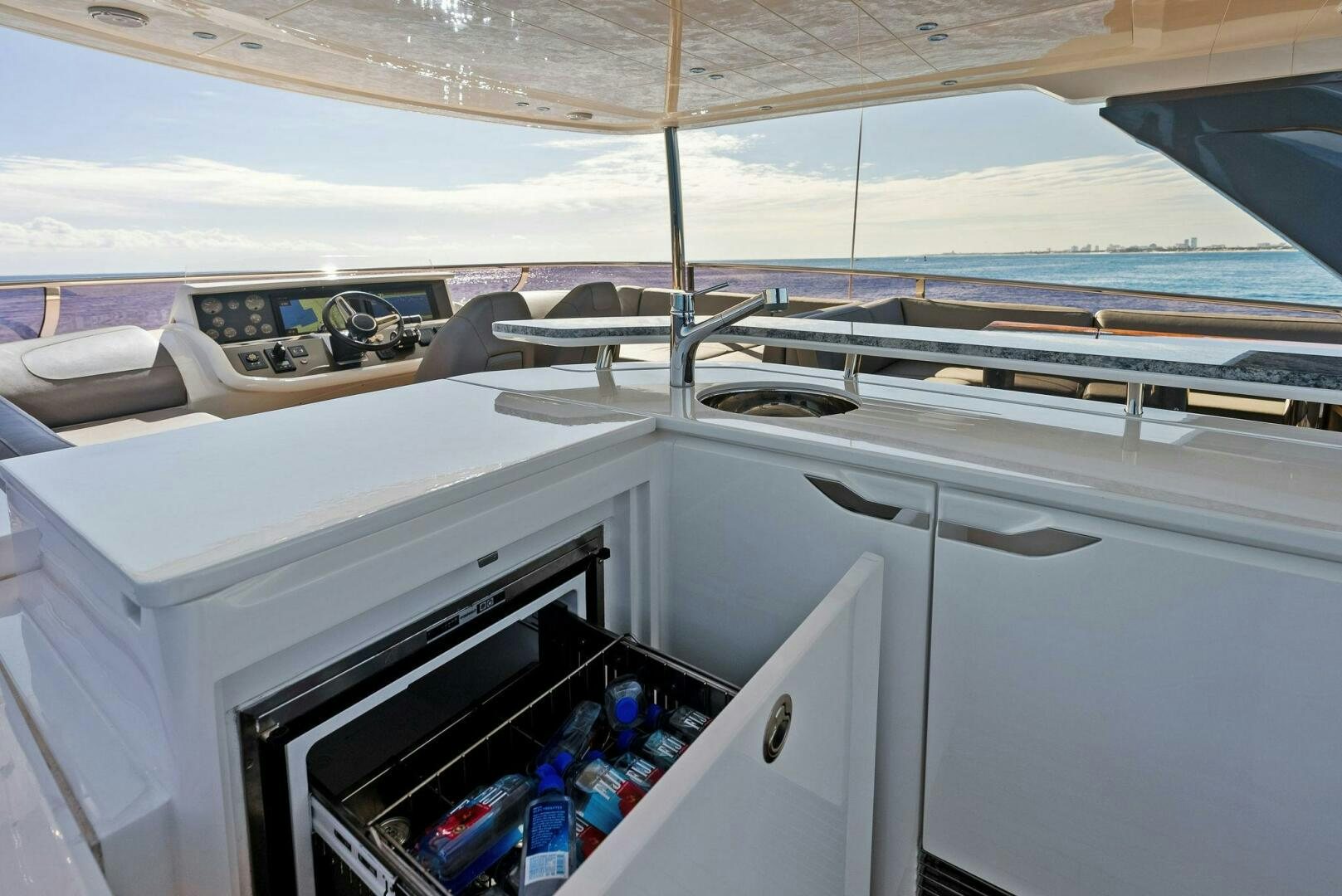 a car with a door open aboard AMICI Yacht for Sale