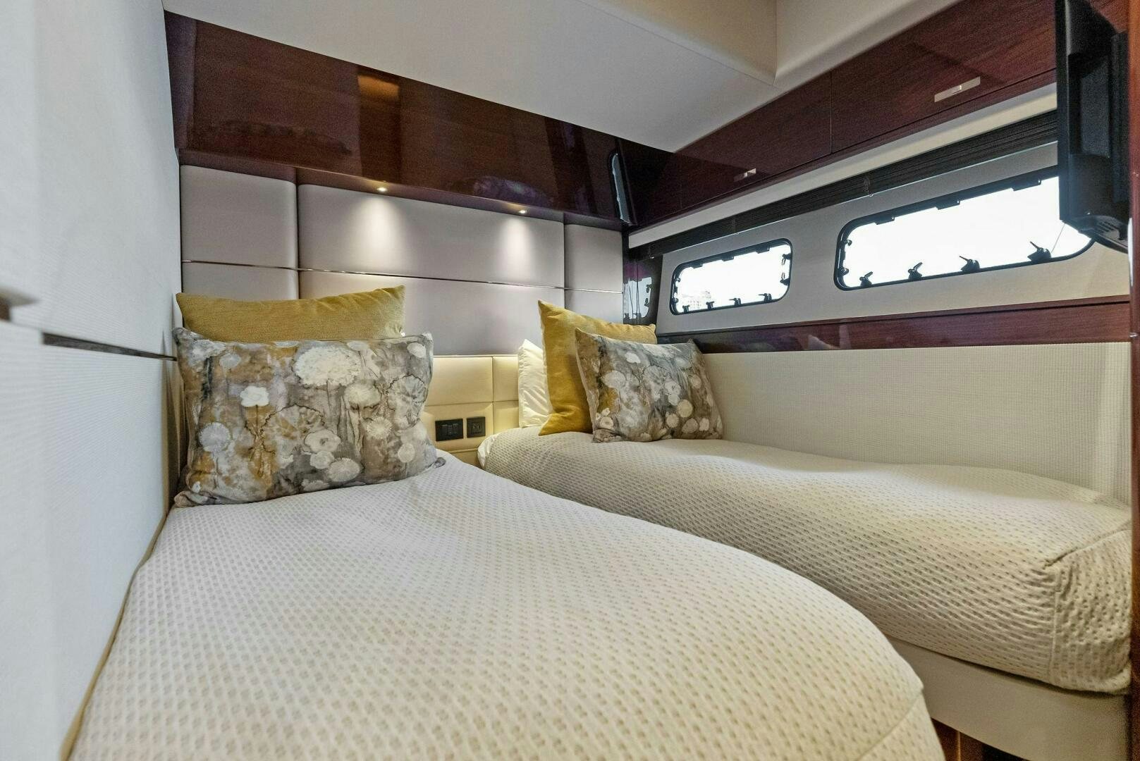 a bed with pillows aboard AMICI Yacht for Sale