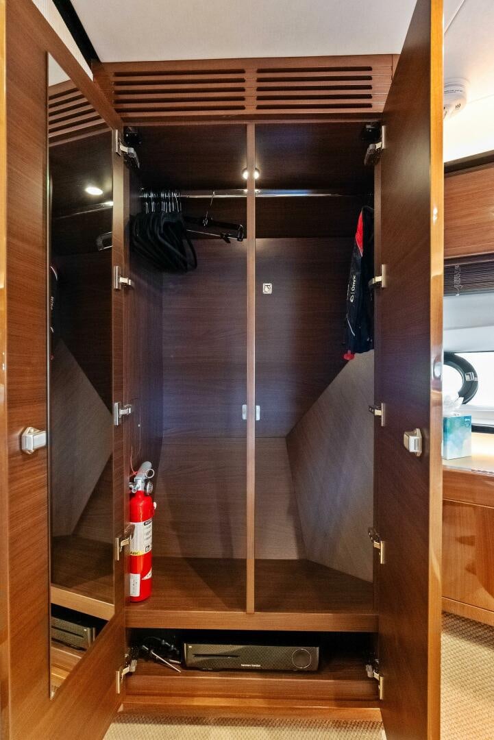 a room with a door and a ladder aboard AMICI Yacht for Sale