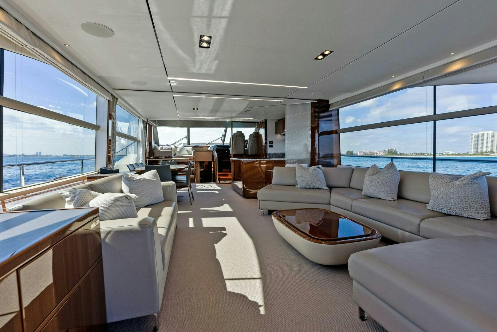a large room with a couch and a table aboard AMICI Yacht for Sale
