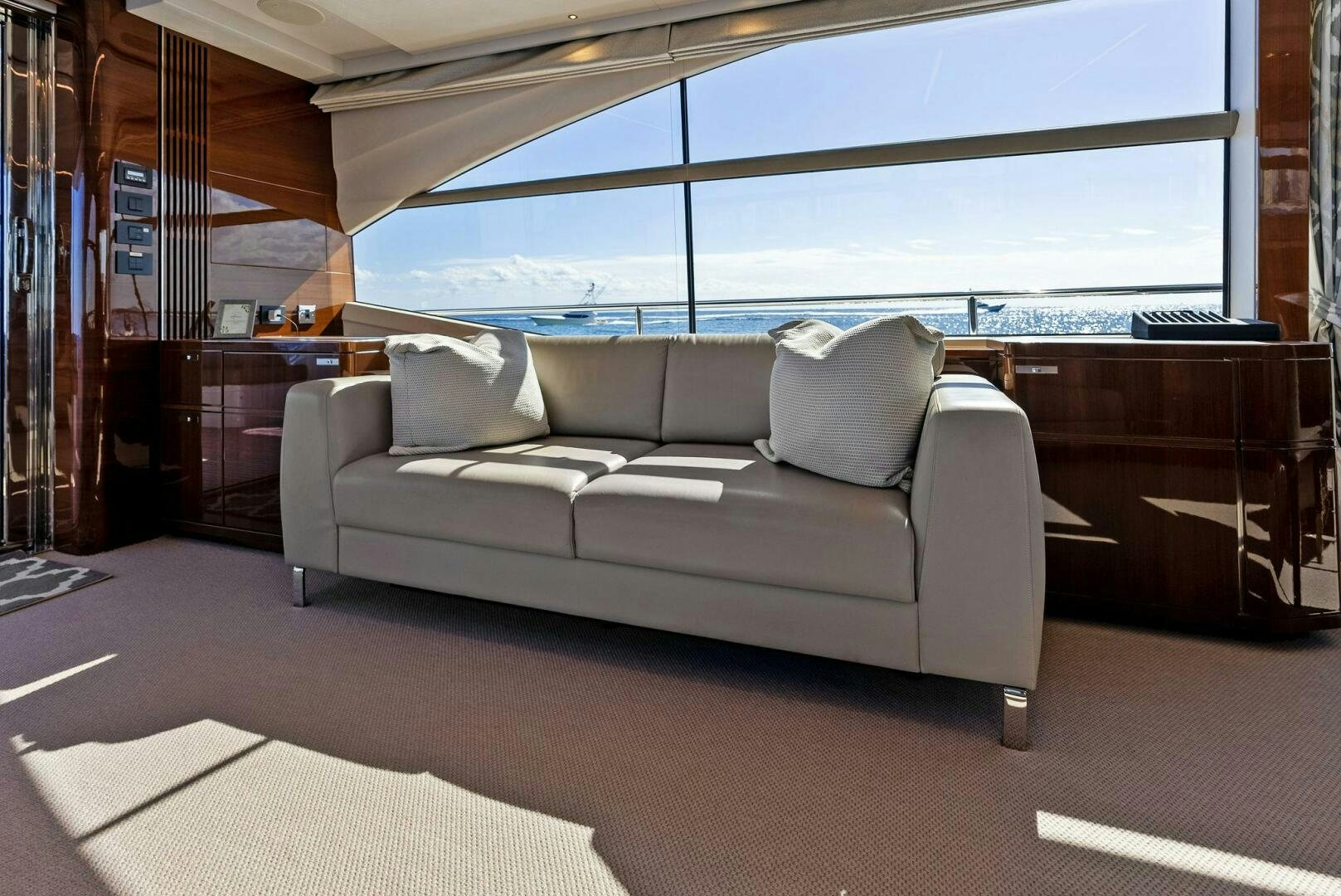a couch in a room aboard AMICI Yacht for Sale