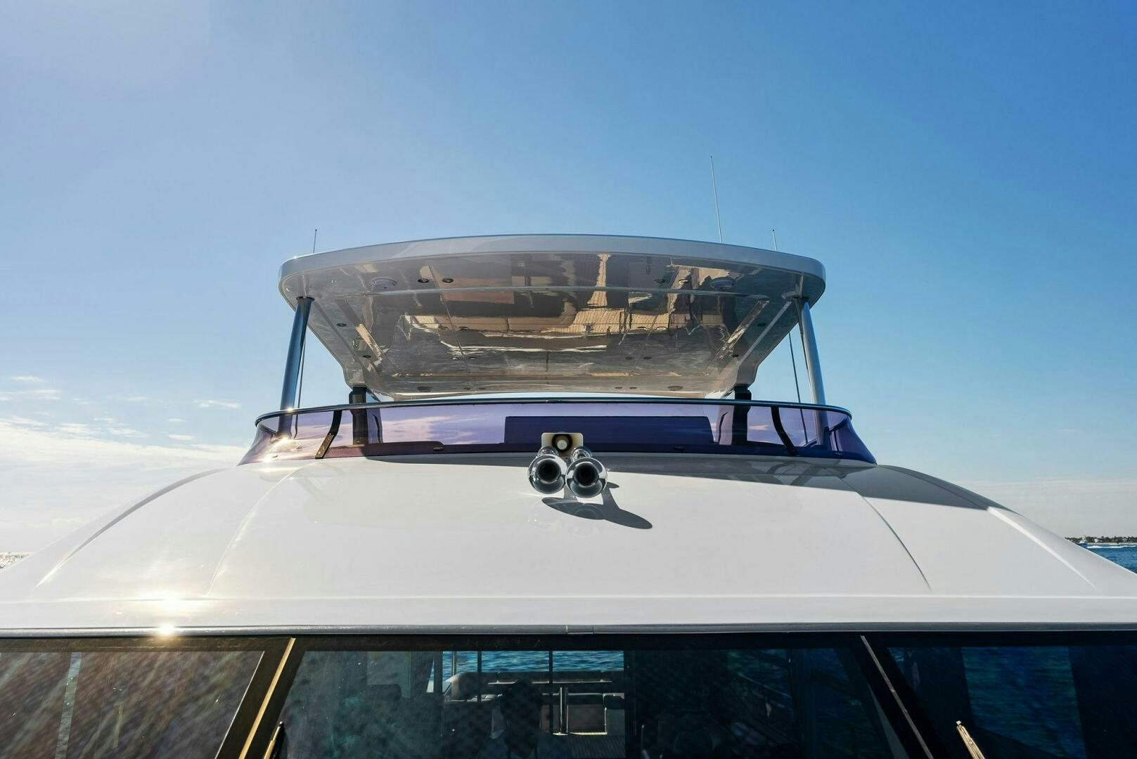 a plane with a plane in the background aboard AMICI Yacht for Sale