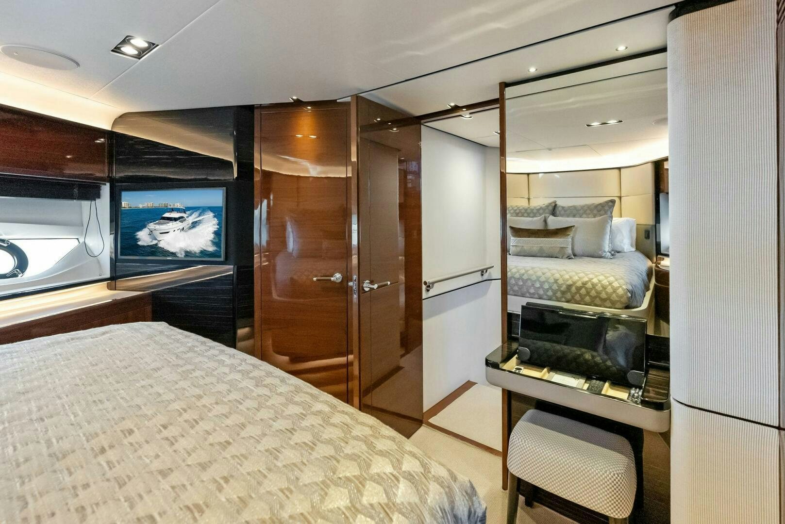a room with a bed and a tv aboard AMICI Yacht for Sale