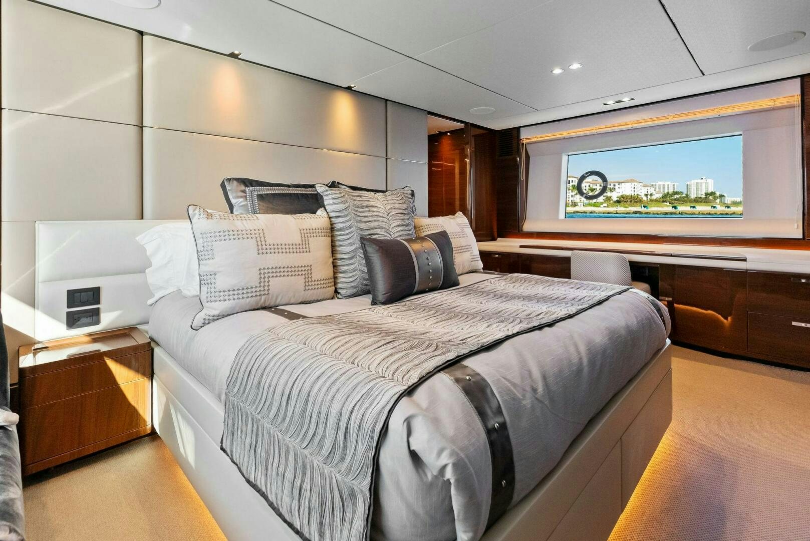 a bed with pillows aboard AMICI Yacht for Sale