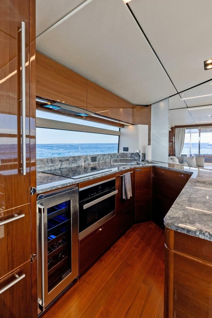 a kitchen with a large island aboard AMICI Yacht for Sale