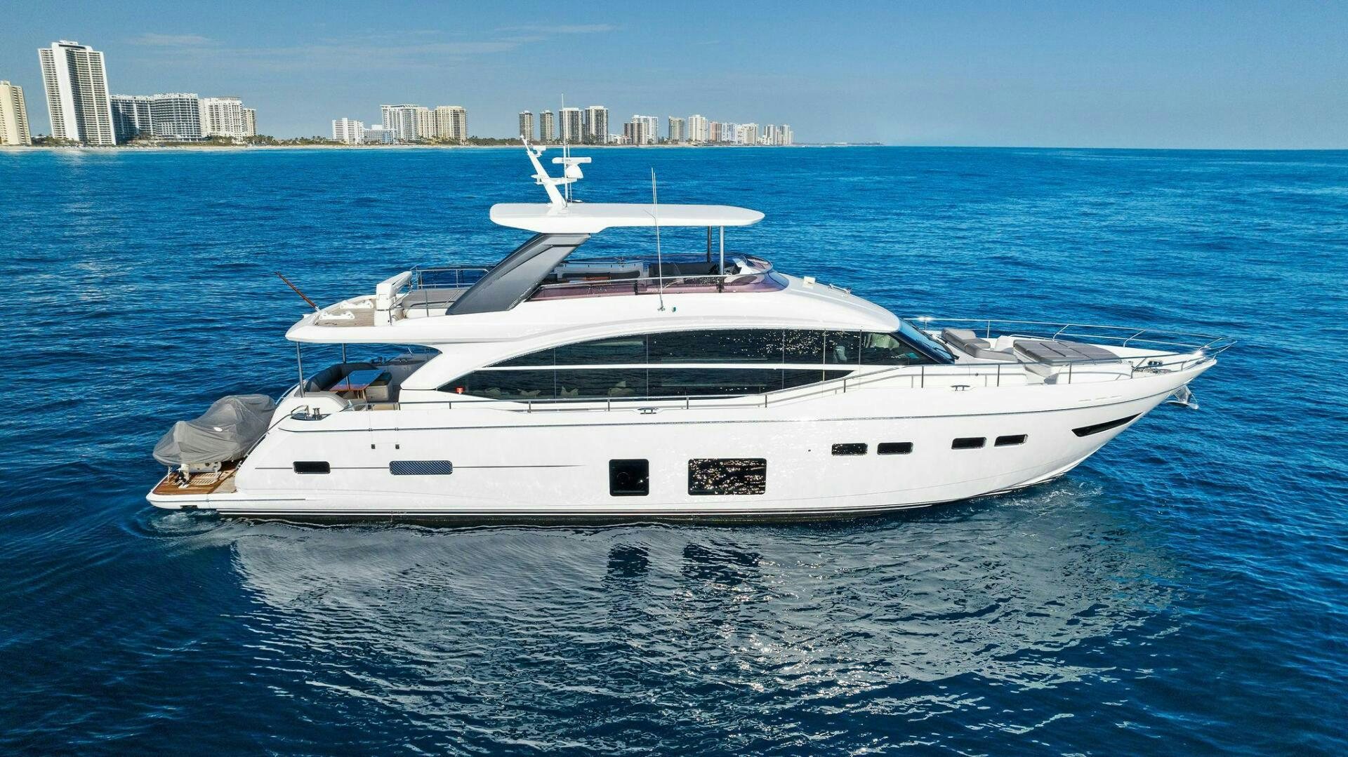 a white yacht in the water aboard AMICI Yacht for Sale