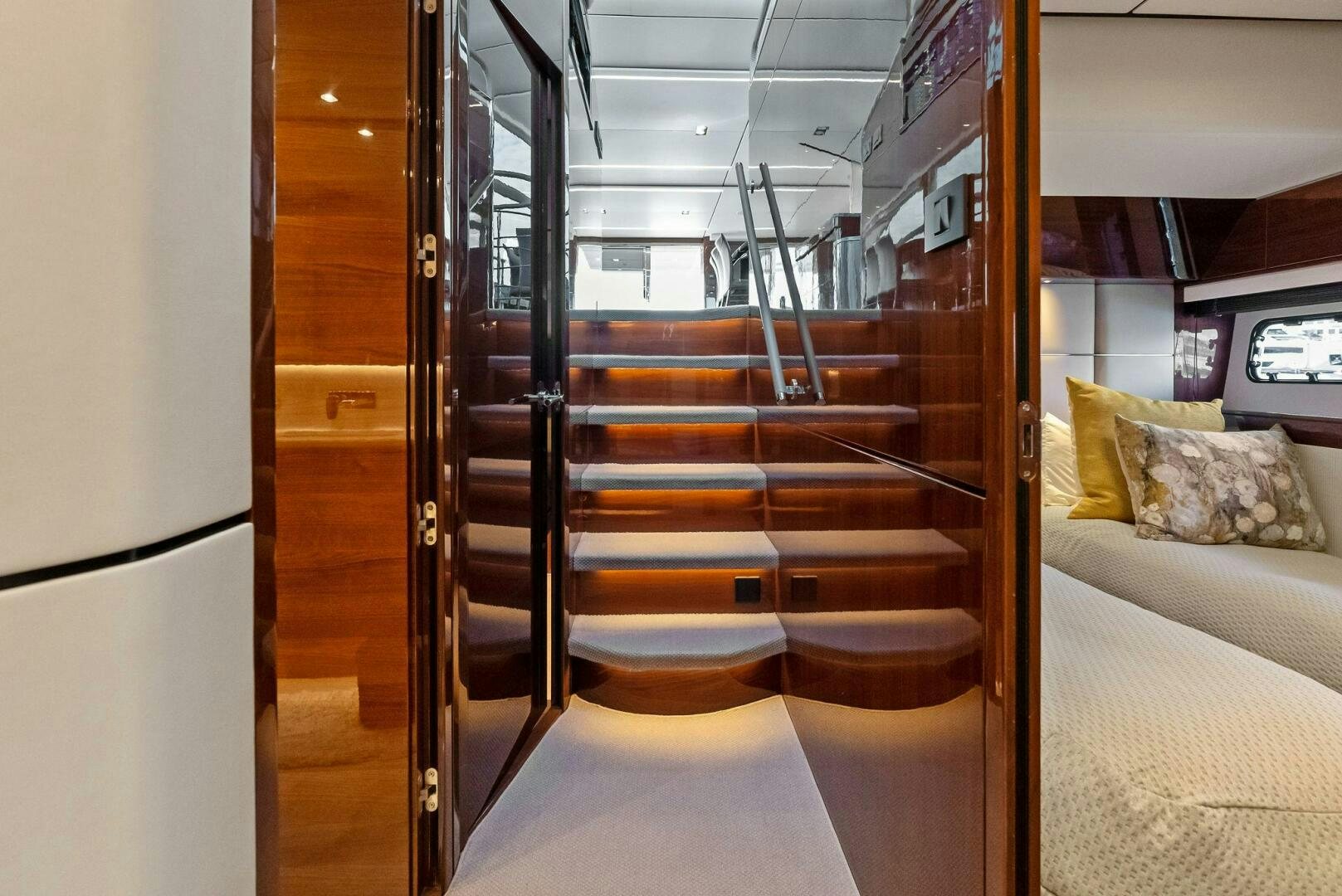 a room with a bed and a couch aboard AMICI Yacht for Sale