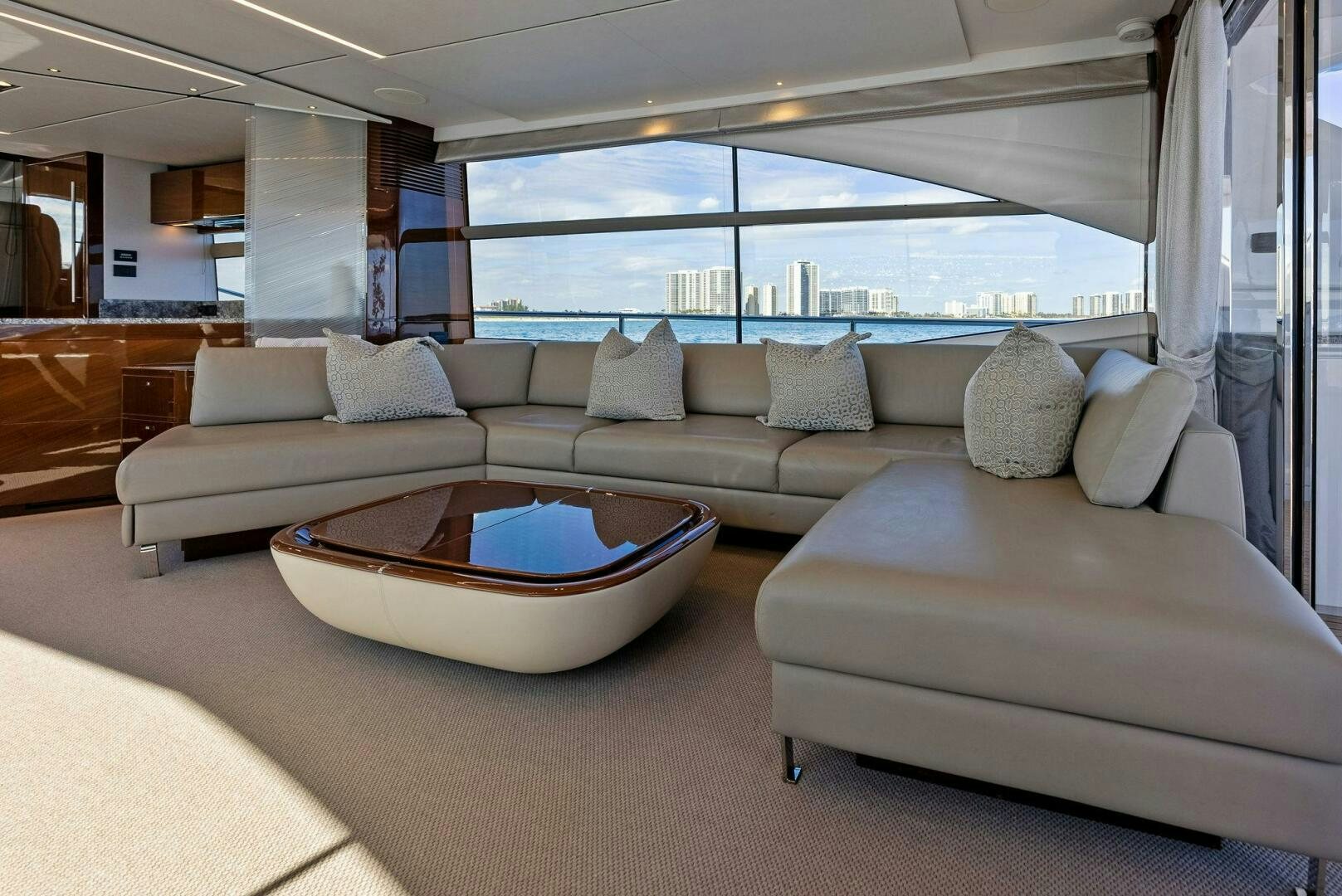a living room with a couch and a table aboard AMICI Yacht for Sale