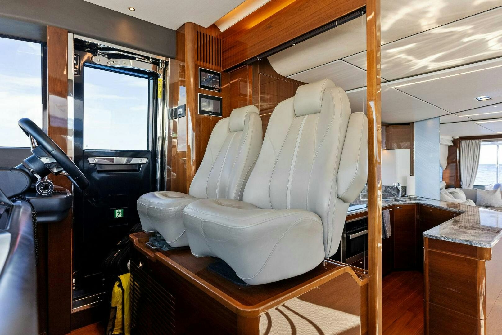 a room with a bed and a television aboard AMICI Yacht for Sale