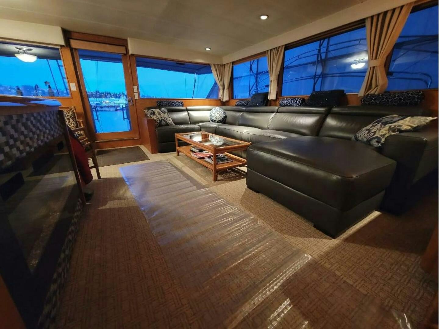 a living room with leather couches aboard GOLDEN EAGLE Yacht for Sale