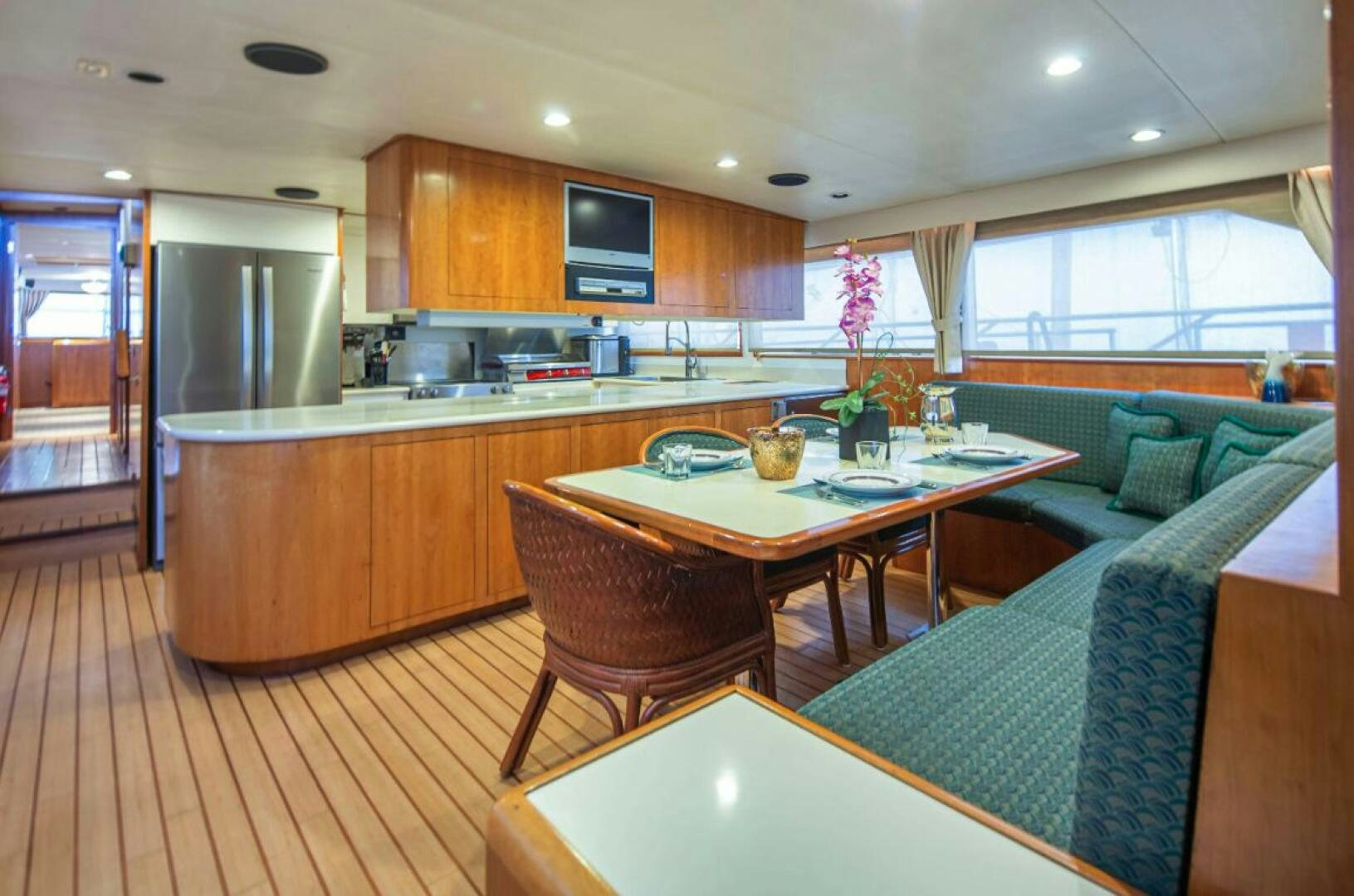 a kitchen with a table and chairs aboard GOLDEN EAGLE Yacht for Sale