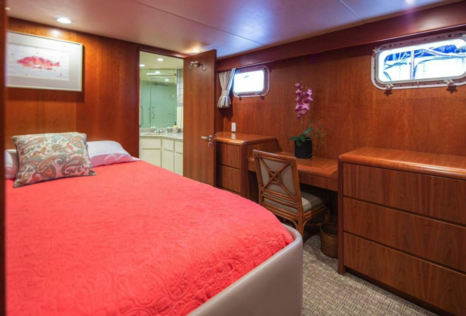 a bedroom with a bed and a chair aboard GOLDEN EAGLE Yacht for Sale