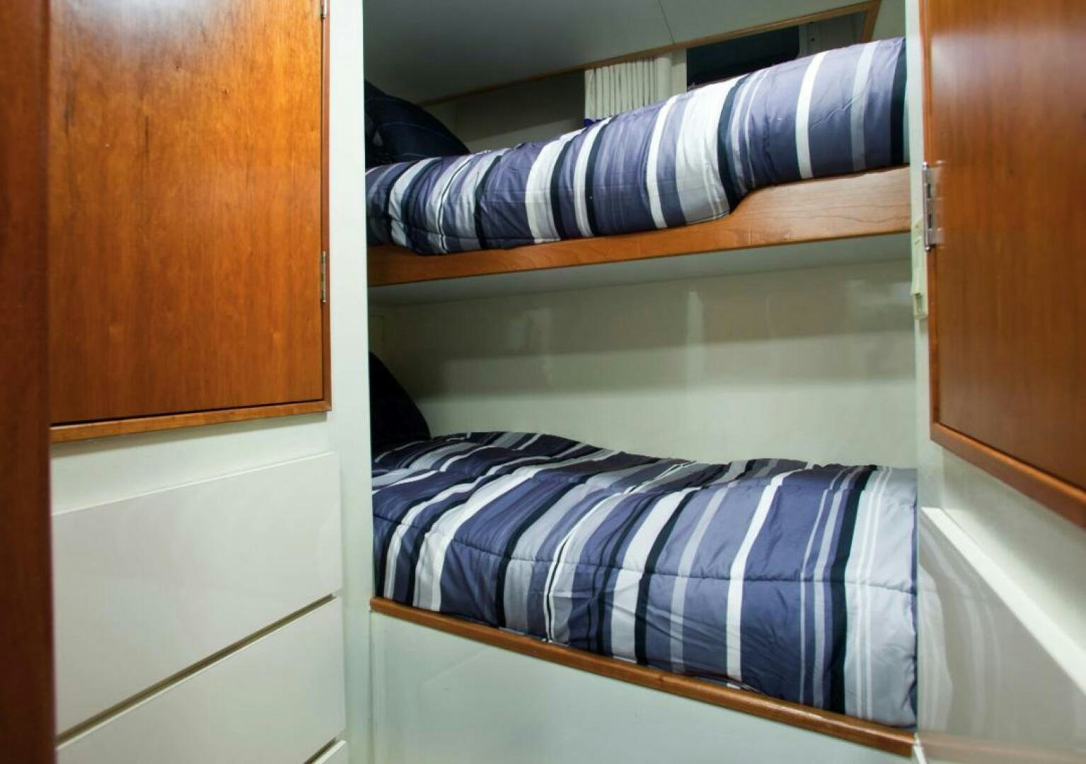 a closet with clothes on the wall aboard GOLDEN EAGLE Yacht for Sale