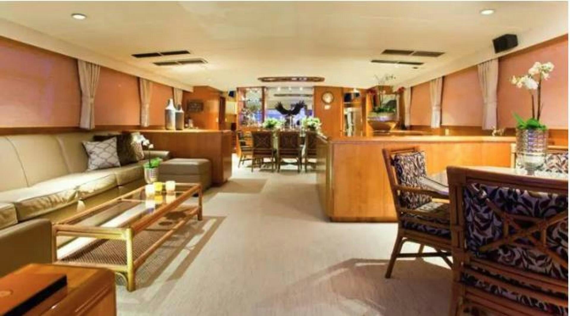 a living room with a couch and a coffee table aboard GOLDEN EAGLE Yacht for Sale