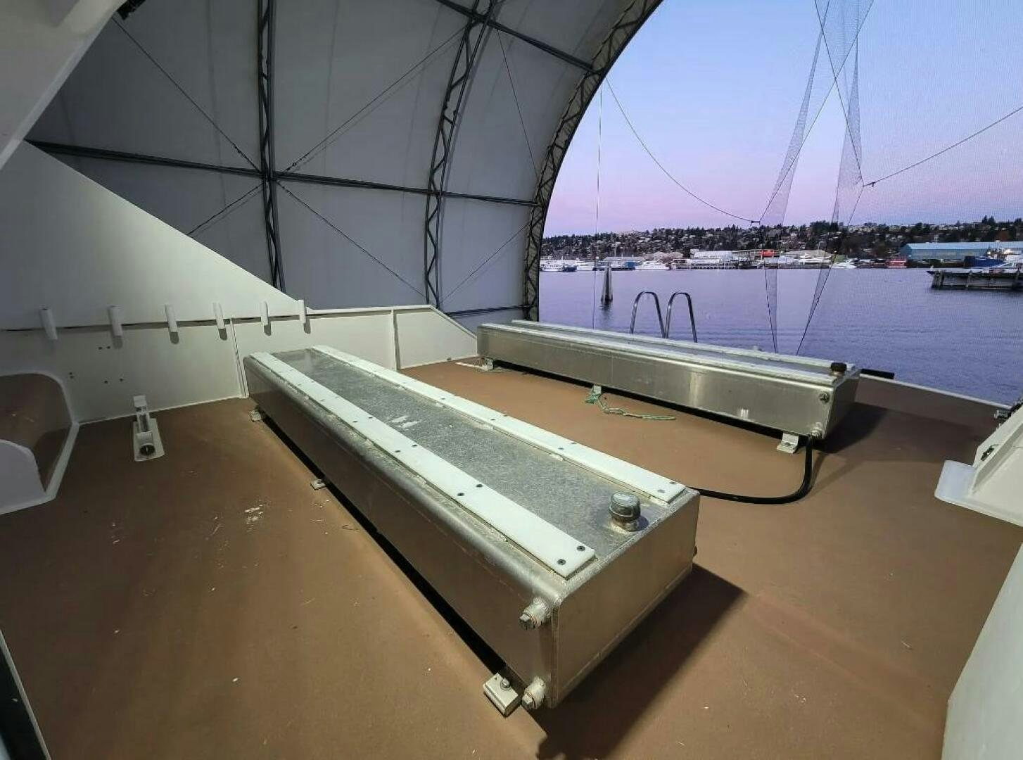 a deck with a large ship in the background aboard GOLDEN EAGLE Yacht for Sale