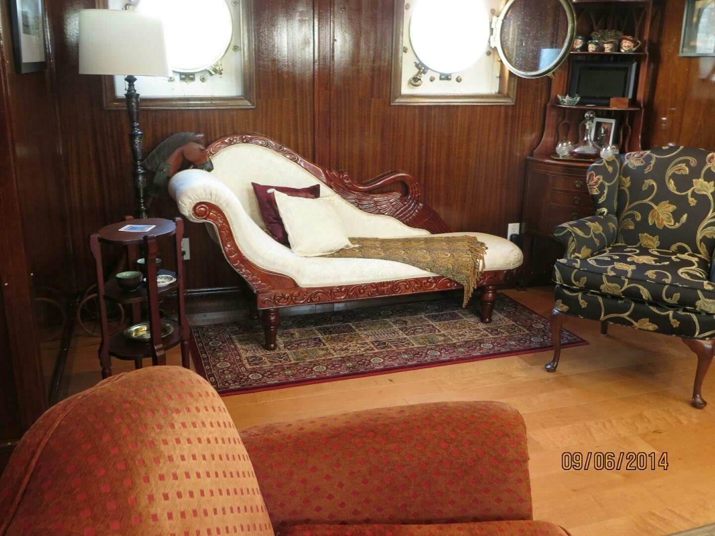 a living room with a couch and a chair aboard PRESCOTONT Yacht for Sale
