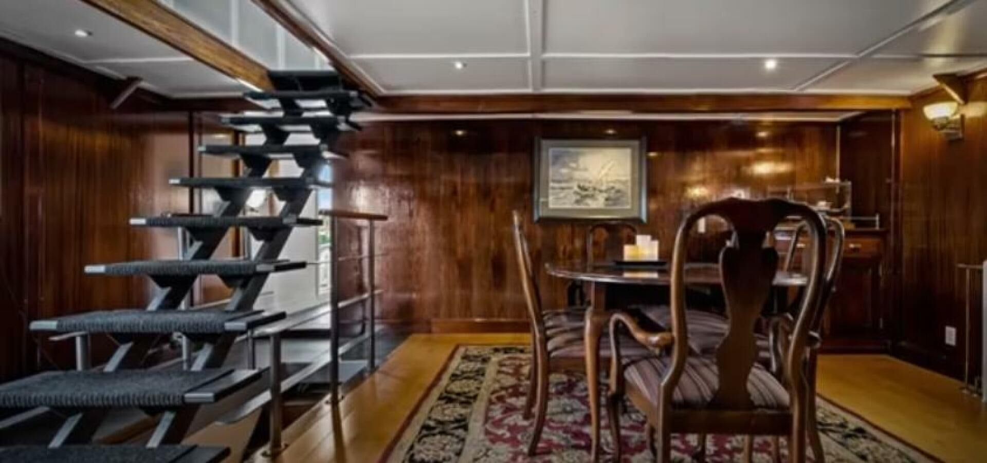 a room with chairs and a table aboard PRESCOTONT Yacht for Sale