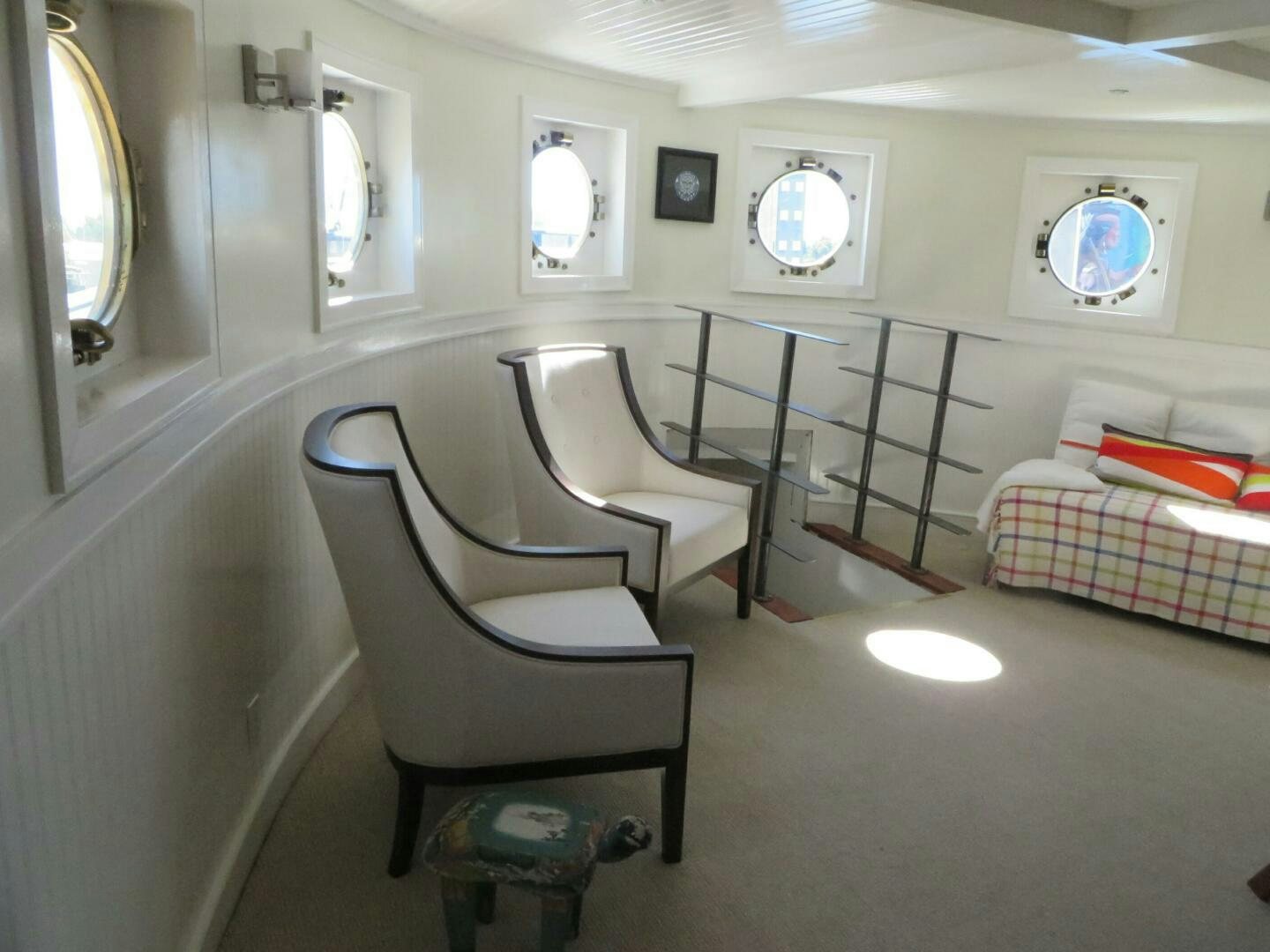 a room with chairs and a bed aboard PRESCOTONT Yacht for Sale