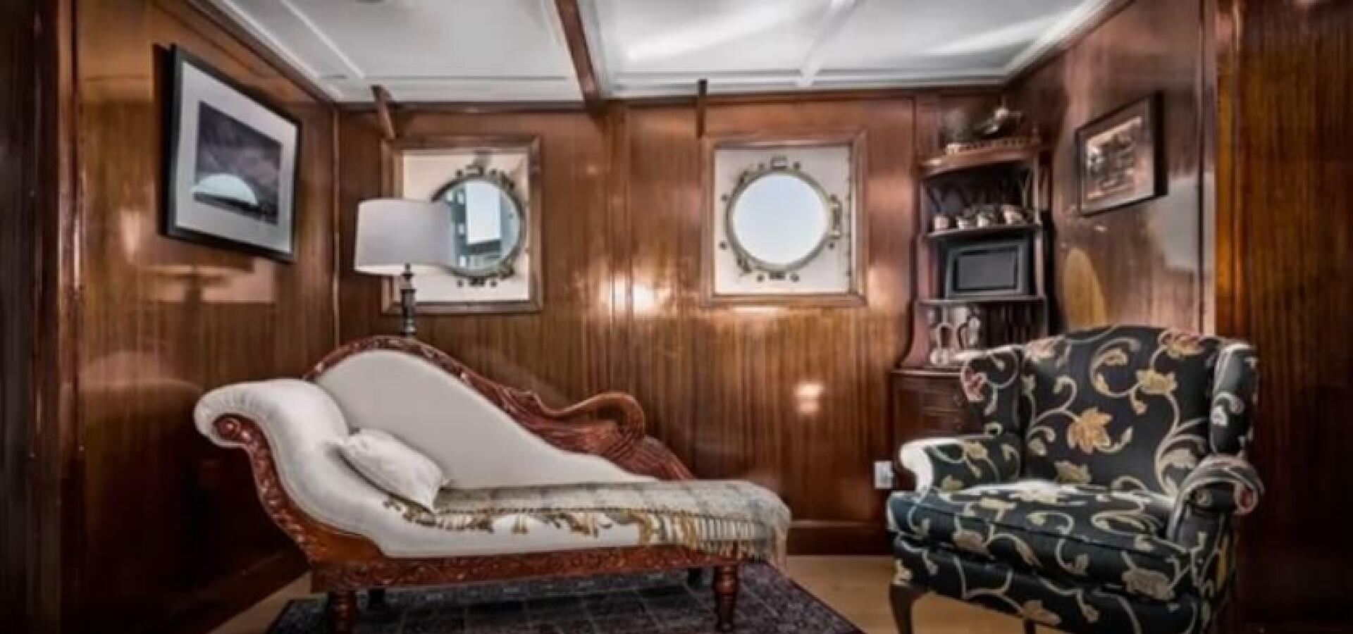a room with a bed and a chair aboard PRESCOTONT Yacht for Sale
