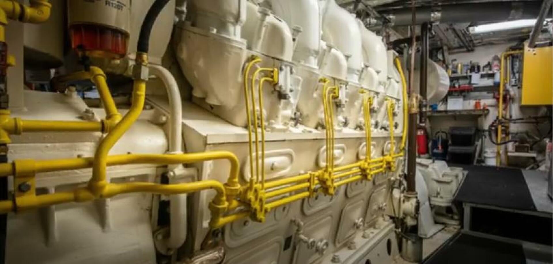a factory with yellow pipes aboard PRESCOTONT Yacht for Sale